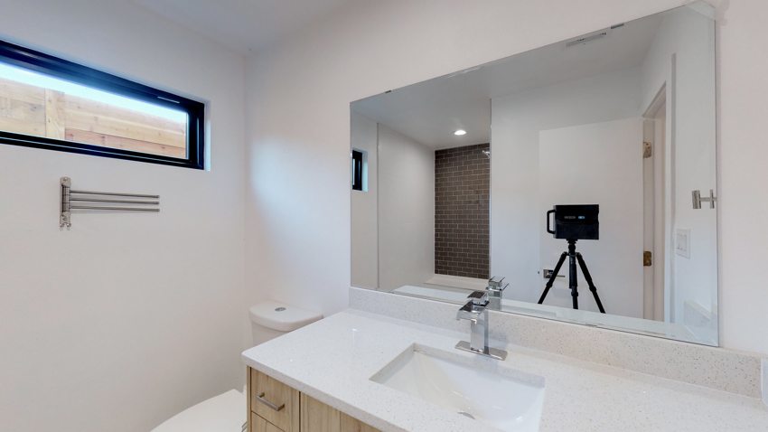 Bathroom vanity and natural light — Munger Avenue · Dallas