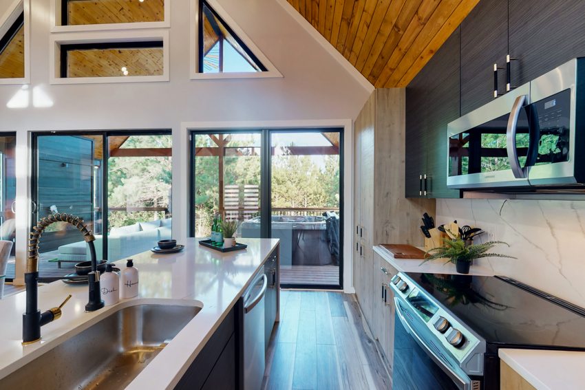 Kitchen island and open gathering space — Blue Spruce · Broken Bow