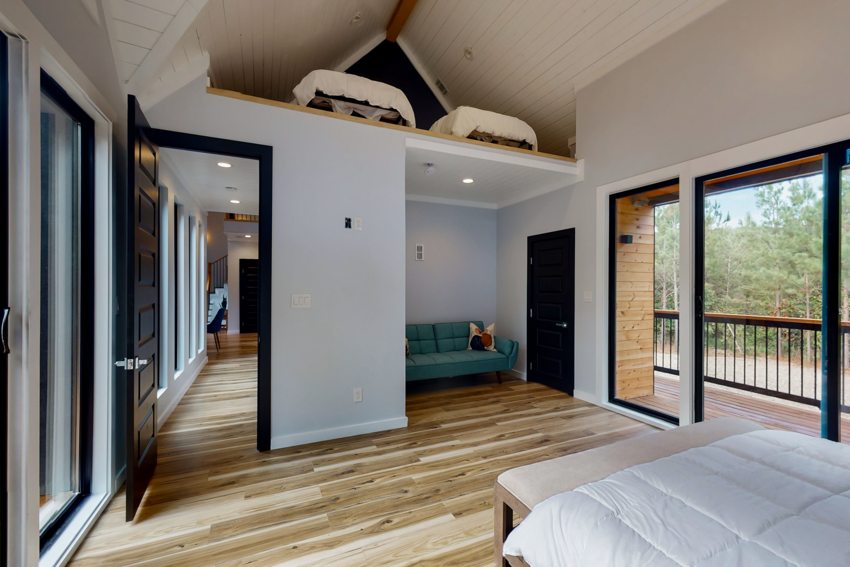 Bedroom with loft and wooded views — Blue Spruce · Broken Bow