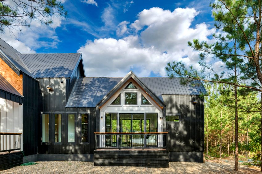 Cabin exterior in the wooded setting — Blue Spruce · Broken Bow