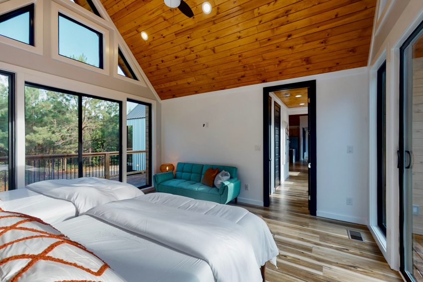 Bedroom with vaulted wood ceiling — Blue Spruce · Broken Bow