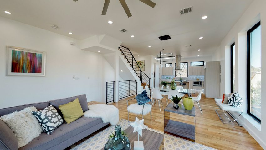 Living room and open staircase — Munger Avenue · Dallas