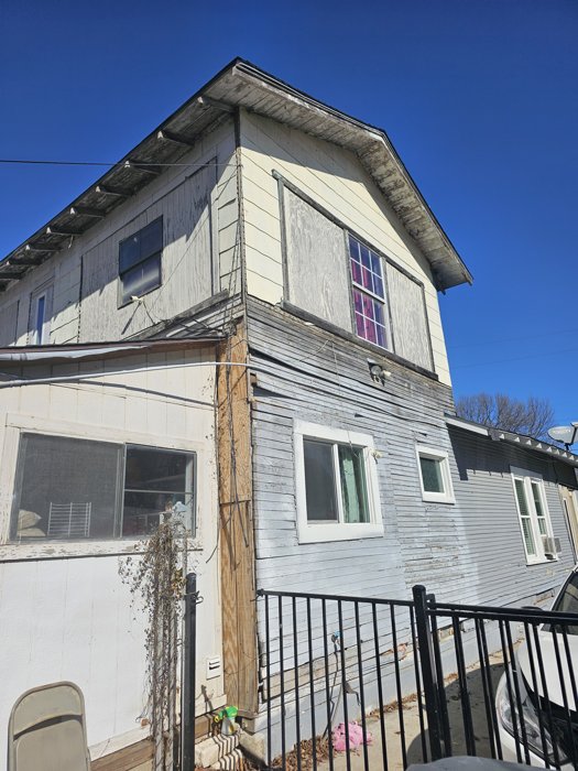 Exterior siding condition documented before repair