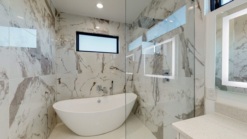 Primary bath with statement stone — Munger Avenue · Dallas