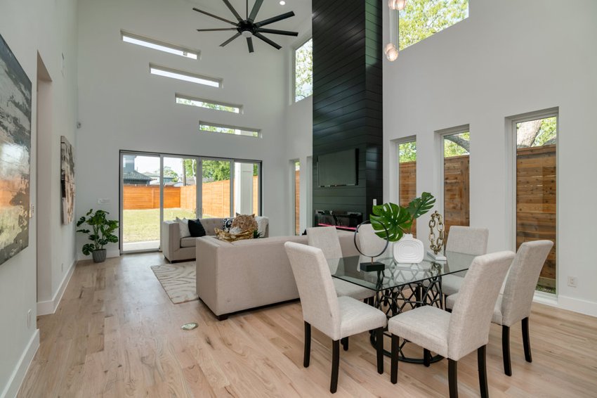 Double-height living and dining space — W. University · Dallas