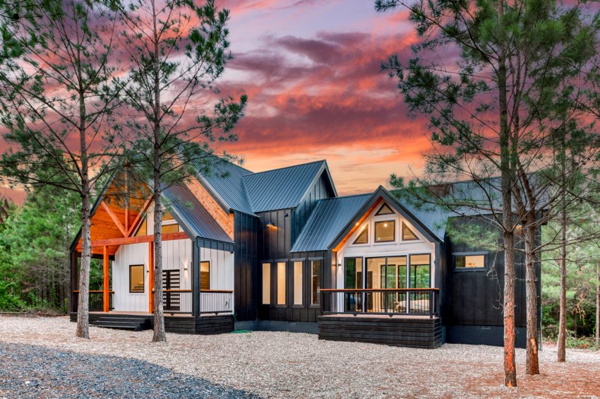 Timber entry and cabin exterior at sunset — Blue Spruce · Broken Bow