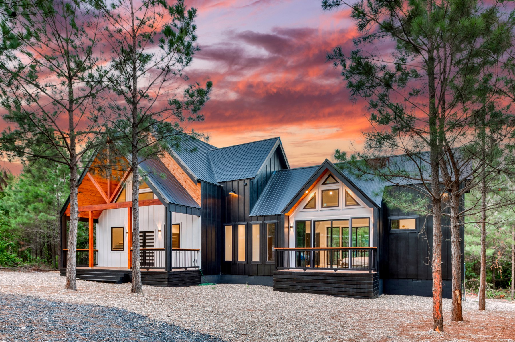 REKJ luxury cabin at dusk among trees