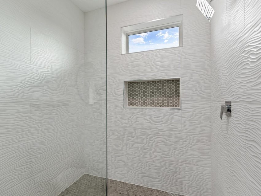 Walk-in shower and tile detail — Delano · Dallas