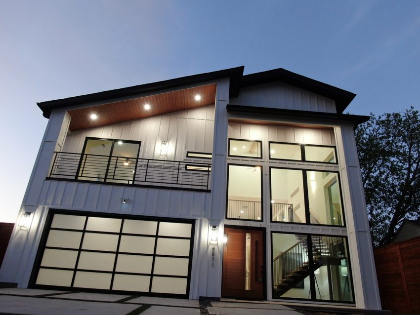 Illuminated exterior at dusk — W. University · Dallas