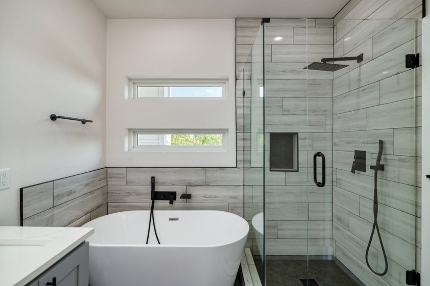 Freestanding tub and tiled shower — W. University · Dallas